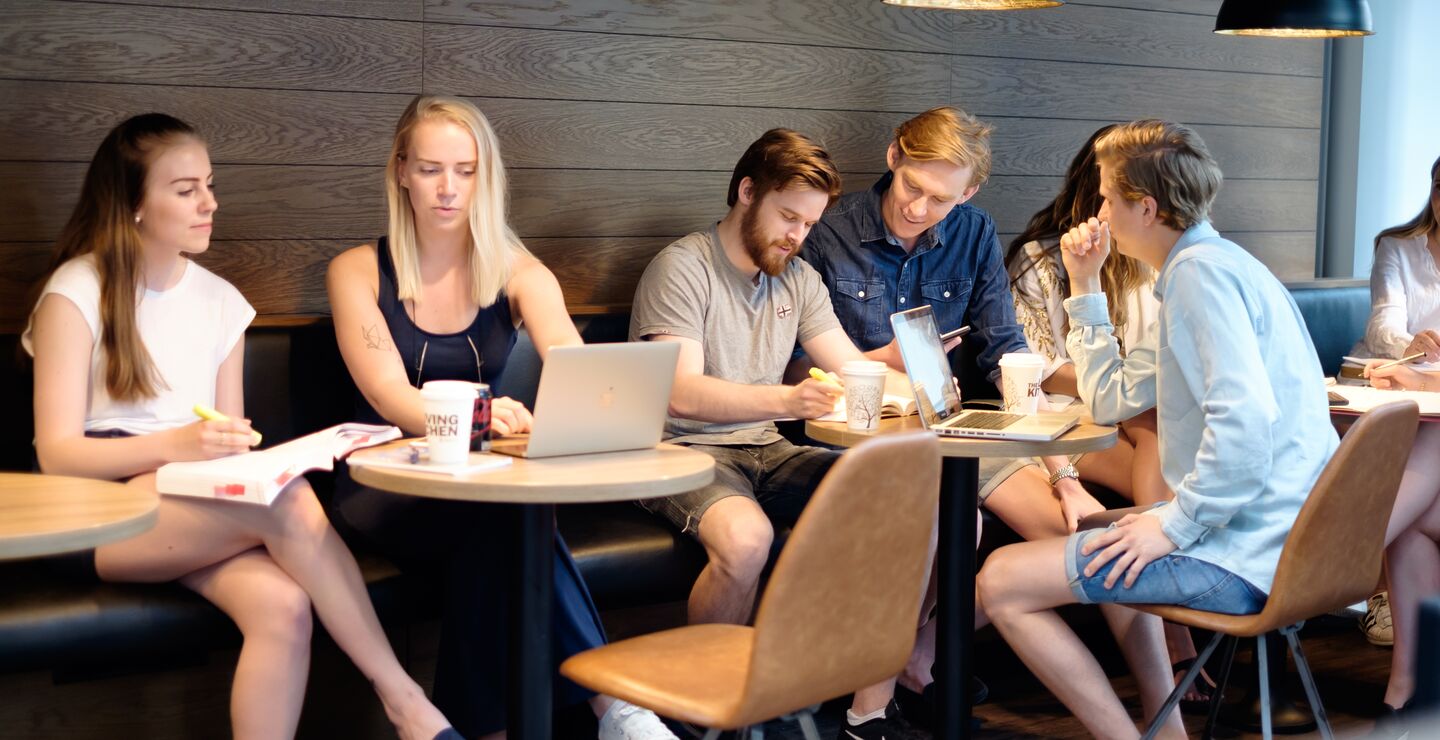 Students studying together at  the coffee shop in BI Oslo