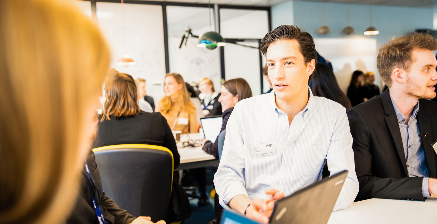 Two people talking at an office